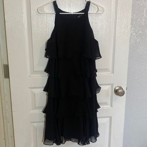 Beautiful sleeveless black dress with flowy ruffles